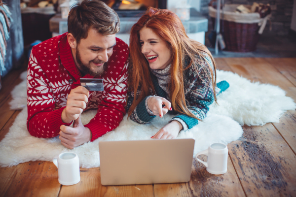 A couple looking at their finances on a computer.