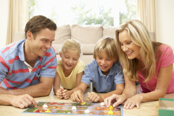 Family playing a board game.