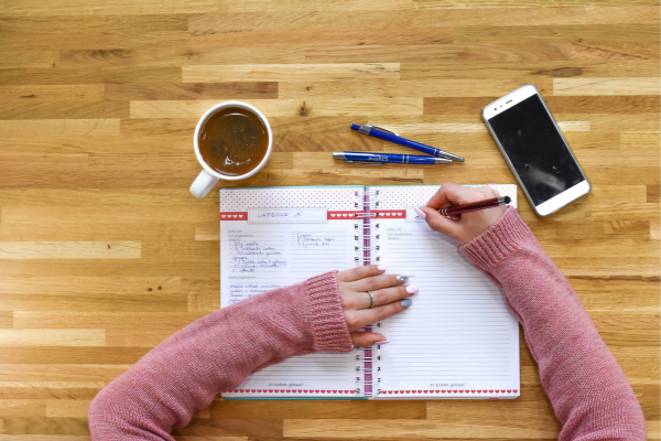 Woman filling in a financial planner