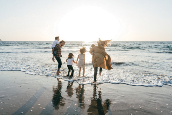 A family enjoying a vacation of the beach